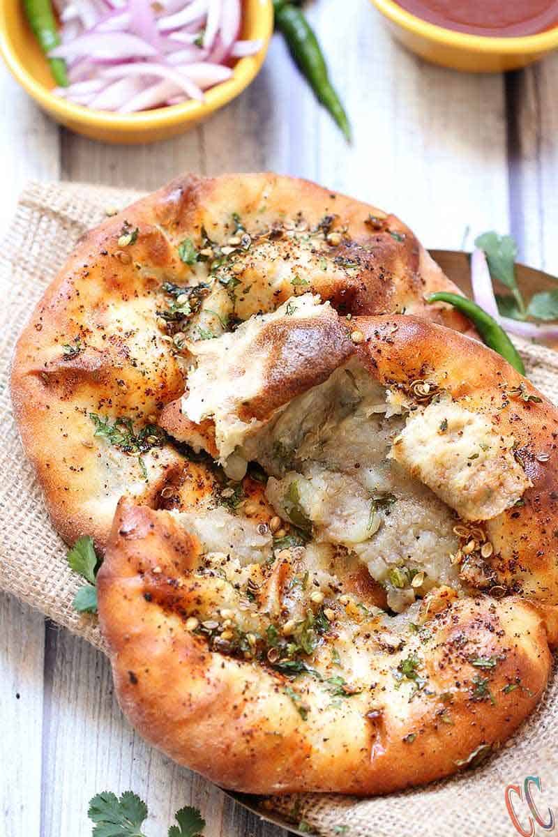 Amritsari Kulcha / Kulcha bread is crisp as well as soft leavened bread which is stuffed with boiled and mashed potatoes and spices. This bread is similar to Naan. This the best and easy Stuffed Kulcha recipe ever.