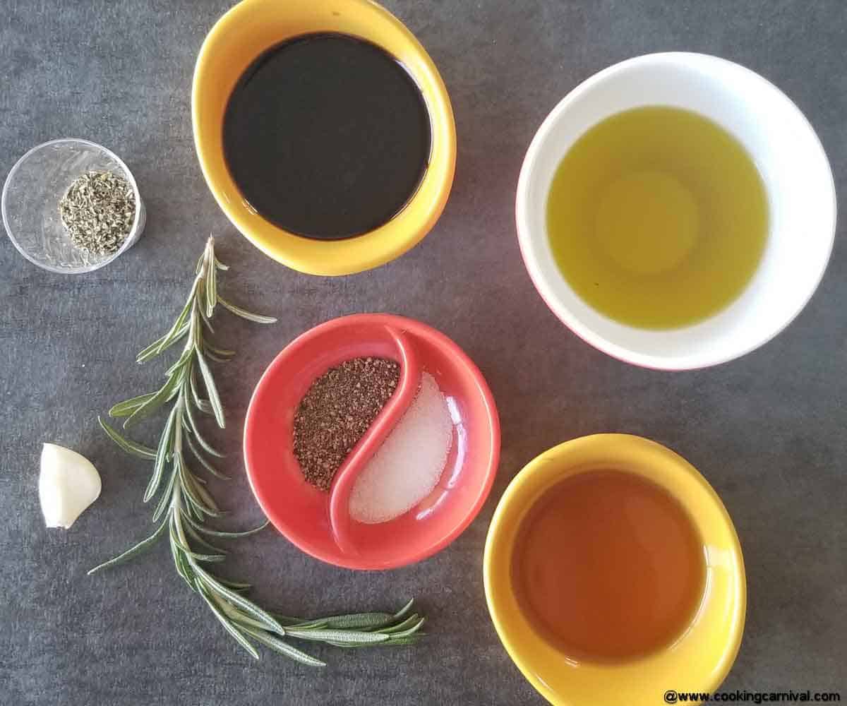 Pre-portioned salad dressing ingredients on a black backdrop.