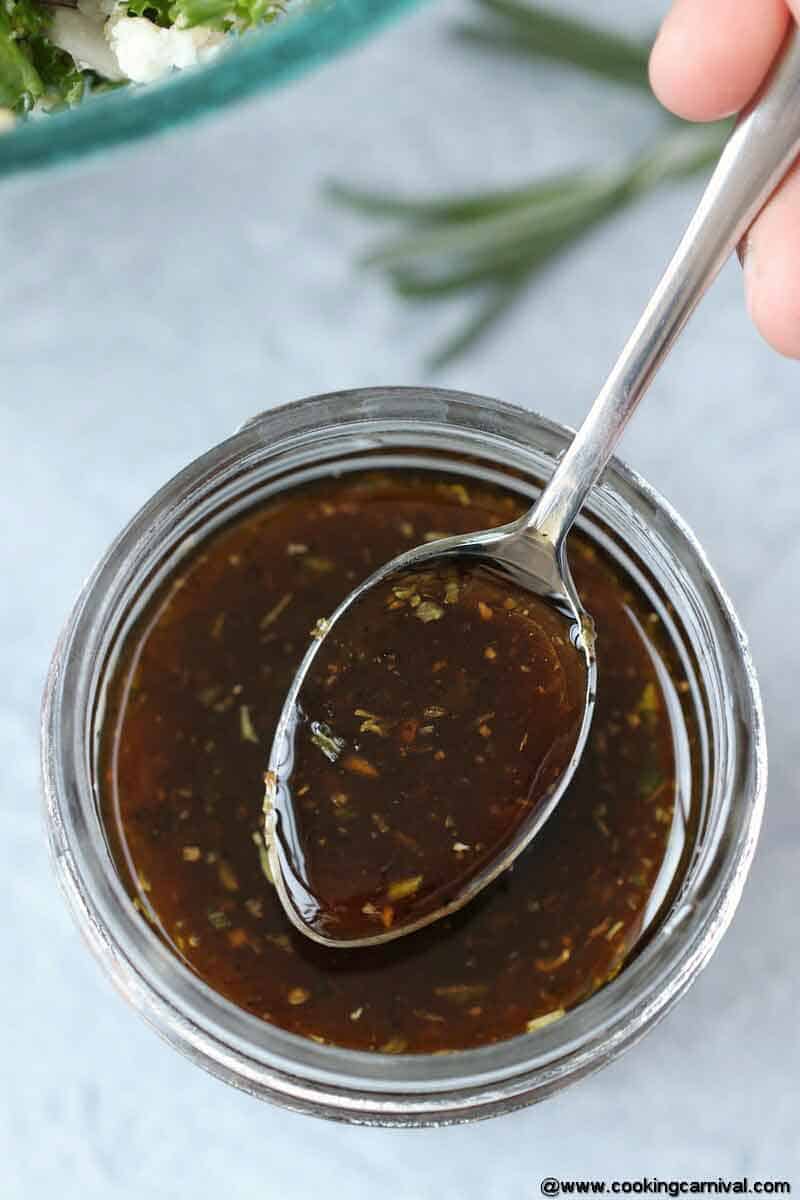 Showing Balsamic Vinaigrette dressing with a spoon