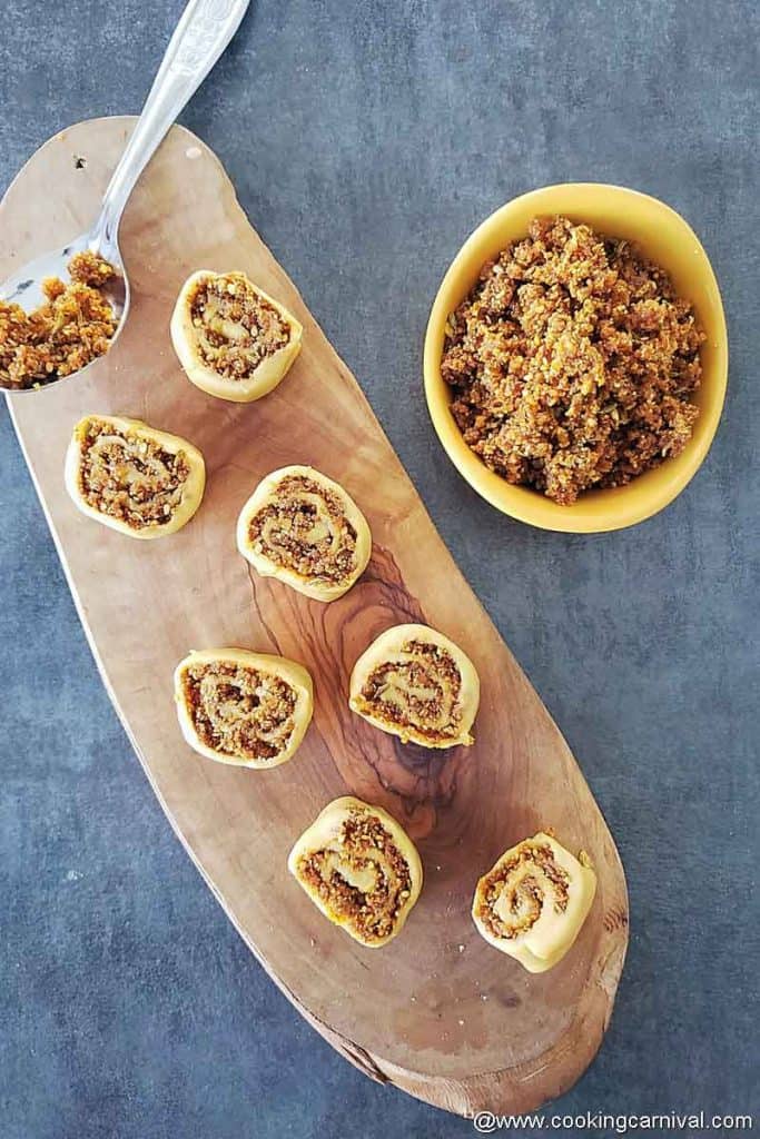 Uncooked bhakarwadi on a wooden board