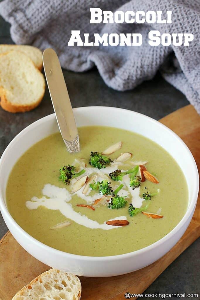 Broccoli soup in white bowl with steel spoon