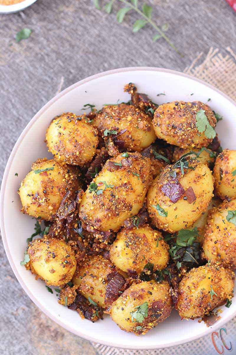 Chettinad Potato fry in white bowl