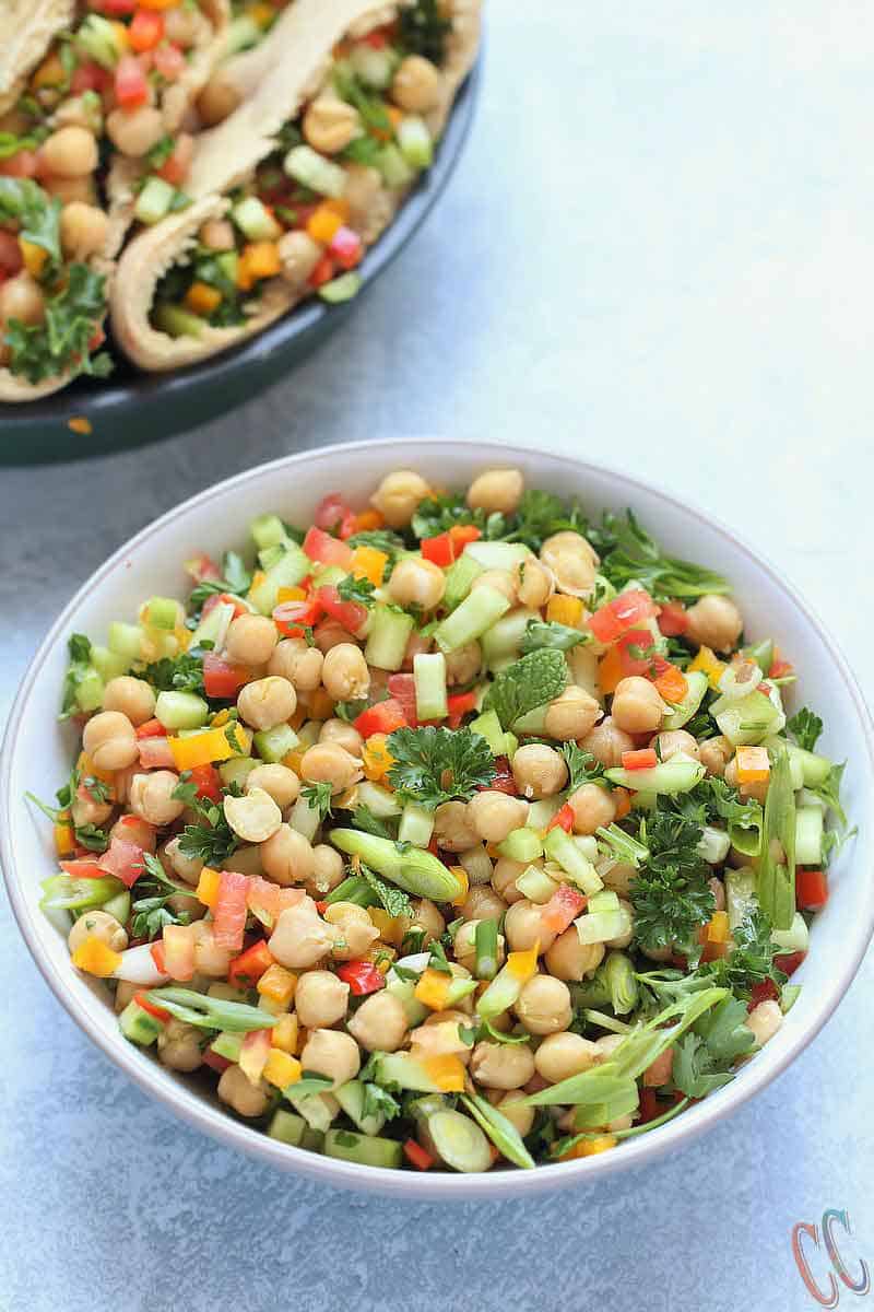 Balela Salad (Bah-lay-la salad) is Middle Eastern-style Chickpea salad. This hearty refreshing salad is bursting with zesty flavor. So easy, so delicious, nutrient dense and satisfying meal! It is perfect for any party or busy weeknight meal.