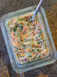 Curd sandwich mixture in a Pyrex bowl with spoon