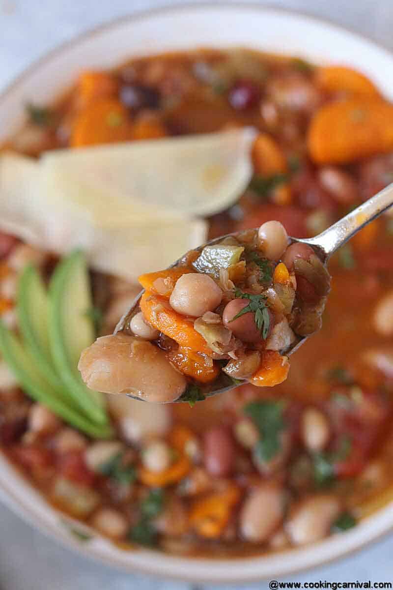 Beans soup in a spoon, closer shot