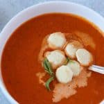 Easy tomato basil soup in white bowl in instant pot