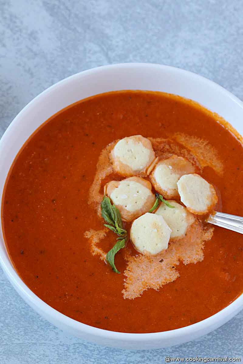 Easy tomato basil soup in white bowl in instant pot