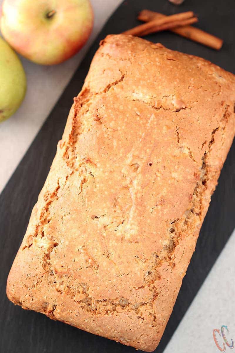 Loaf of Apple cinnamon bread on a black board.