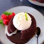 Eggless chcolate lava cake served with vanilla ice cream, berries and mint