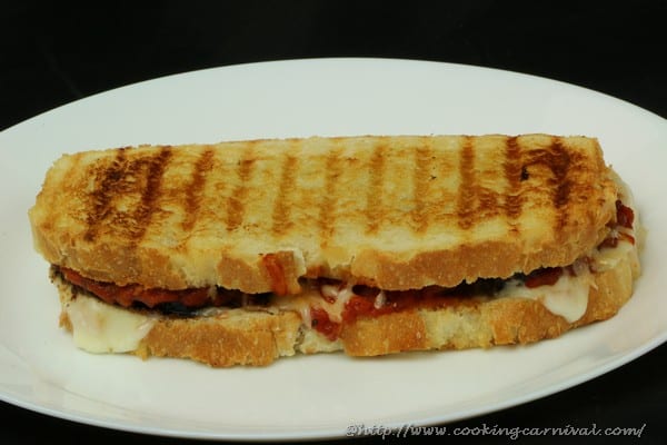 Eggplant Parmesan Sandwich is tangy and cheesy.