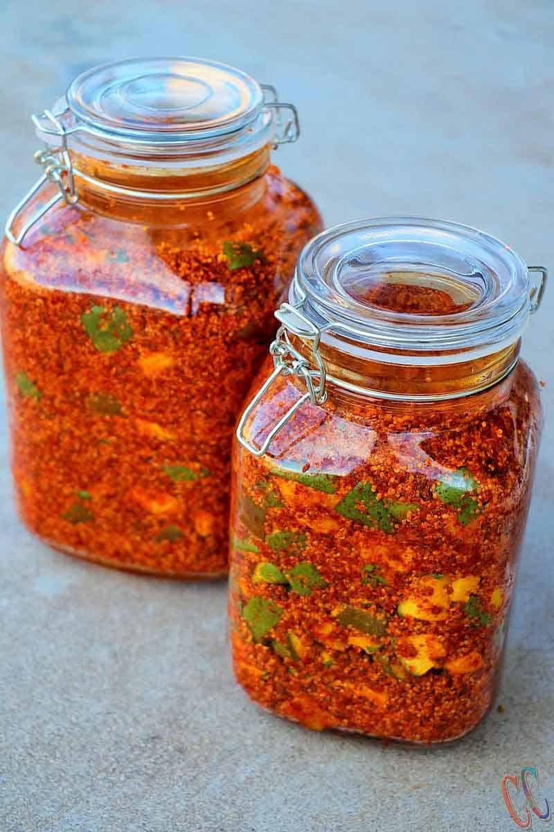 Mango Pickle | Gujarati traditional Methiya Keri Nu Athanu - Finger licking Pickle recipe Made with fresh raw mango, Methi Na Kuriya (coarsly crushed Fanugreek Seeds), Rai Na kuriya (Coarsely crushed mustard seeds), Salt, Red chili powder, Asafetida and Oil.