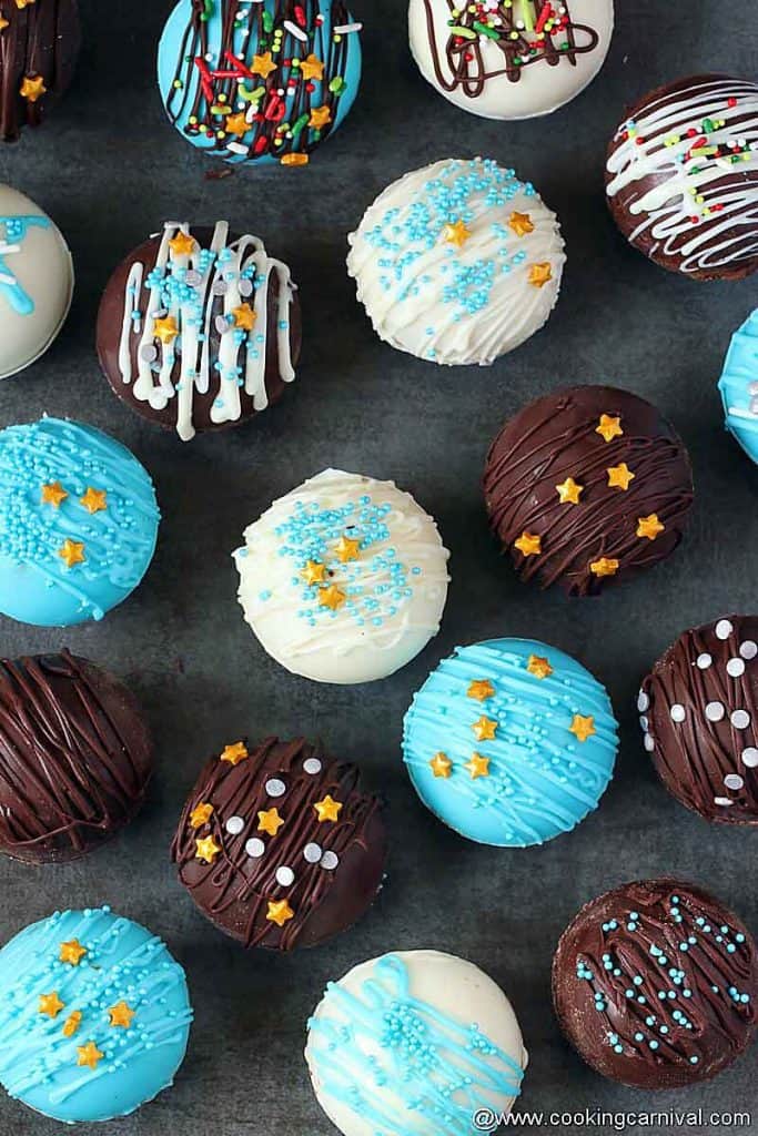 Variety of Hot cocoa bombs on black tile