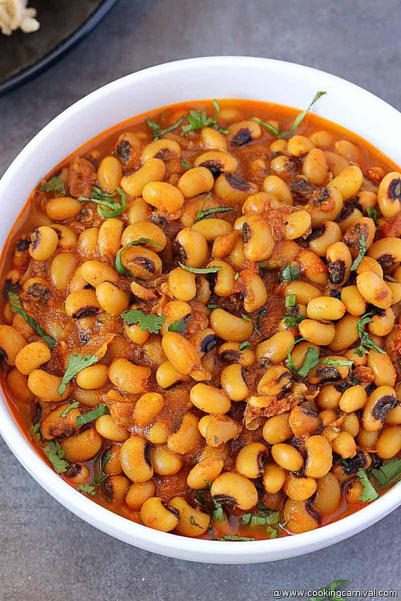 Side angle photo of Instant Pot Black Eyed peas served in white bowl