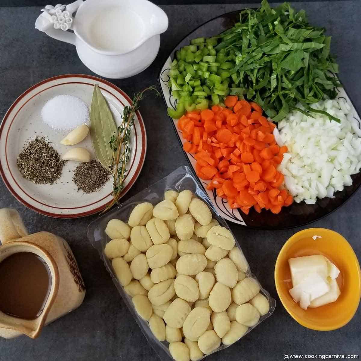 pre-measured ingredients of instant pot gnocchi soup on black backdrop