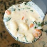 taking ladle full of gnocchi soup from instant pot