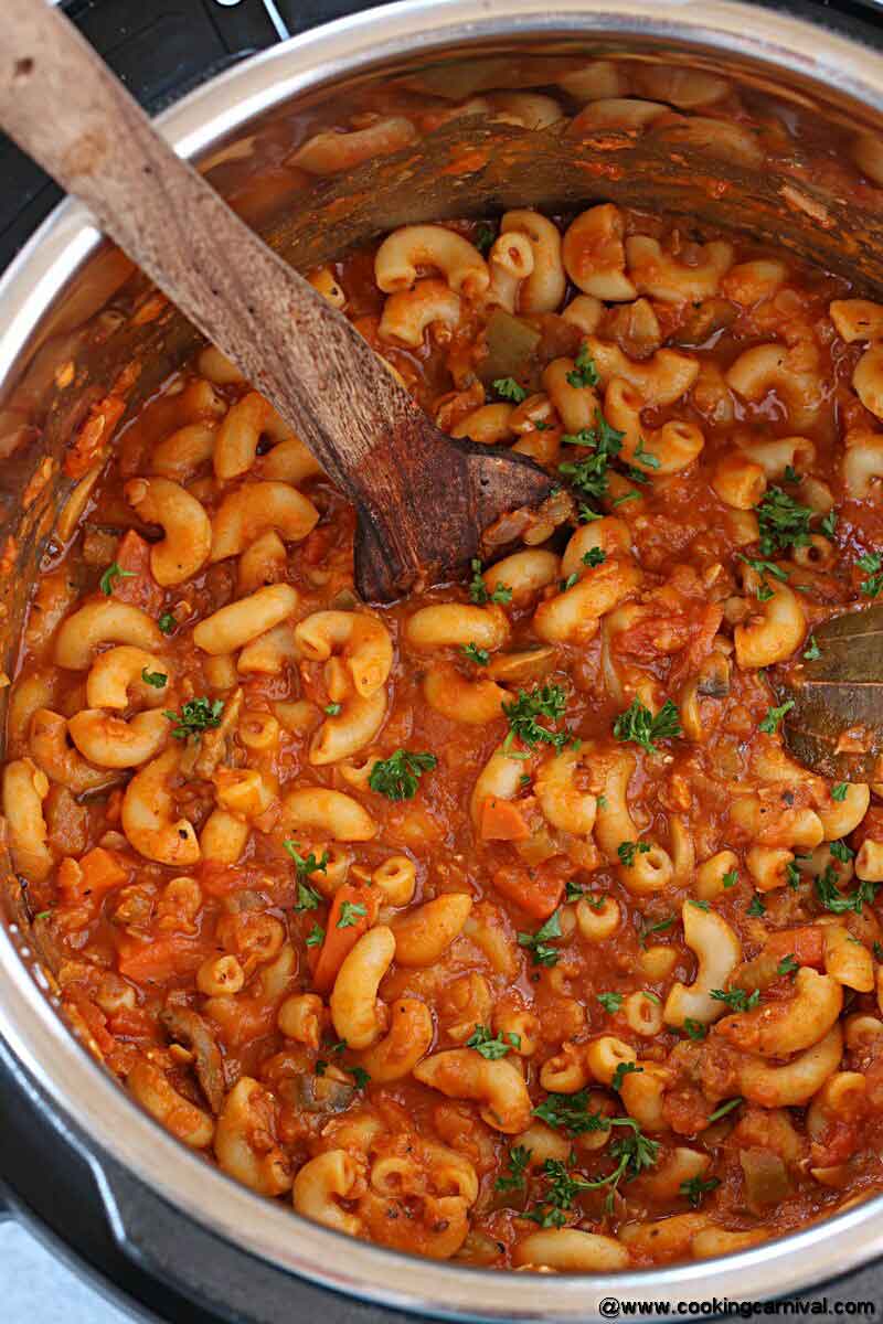 Goulash in a instant pot inner pot with wooden spatula