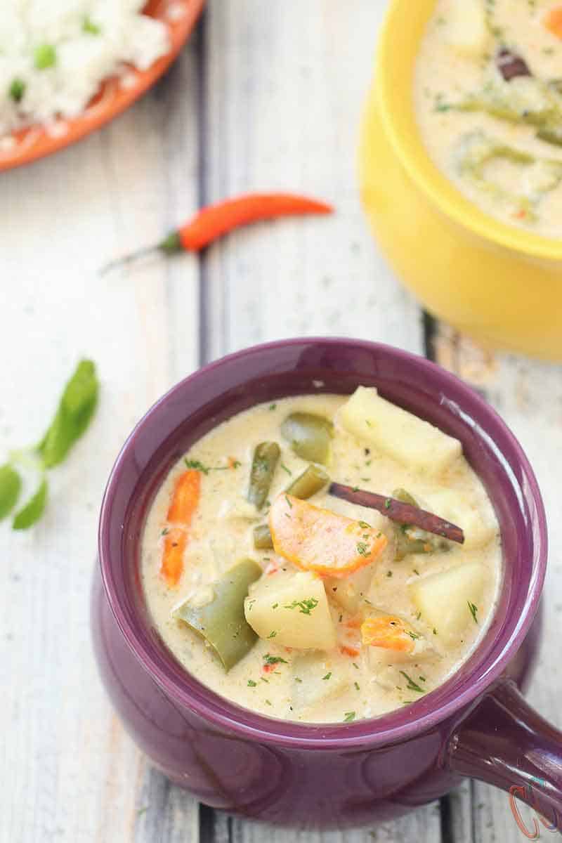 Instant Pot Kerala Vegetable Stew - A complete Comfort and Satisfying food that can be made in a fraction of the time. Veg Stew is Vegetarian / Vegan Instant Pot Recipe with lots of vegetables in a coconut milk based hearty sauce that will change your life.