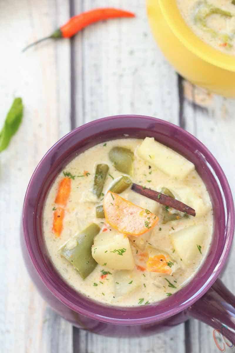 Instant Pot Kerala Vegetable Stew - A complete Comfort and Satisfying food that can be made in a fraction of the time. Veg Stew is Vegetarian / Vegan Instant Pot Recipe with lots of vegetables in a coconut milk based hearty sauce that will change your life.