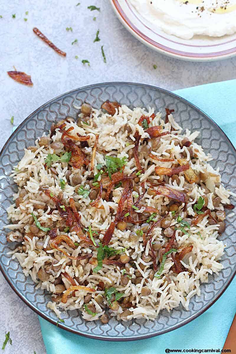 Instant Pot Mujadara (Mujaddara) - A signature Middle Eastern dish made with lentils and rice and garnished with crispy fried onions! It is gluten free, vegan and one of the most comforting one pot meal! It is one of the favorite Vegetarian side dishes and it is protein rich filling meal.