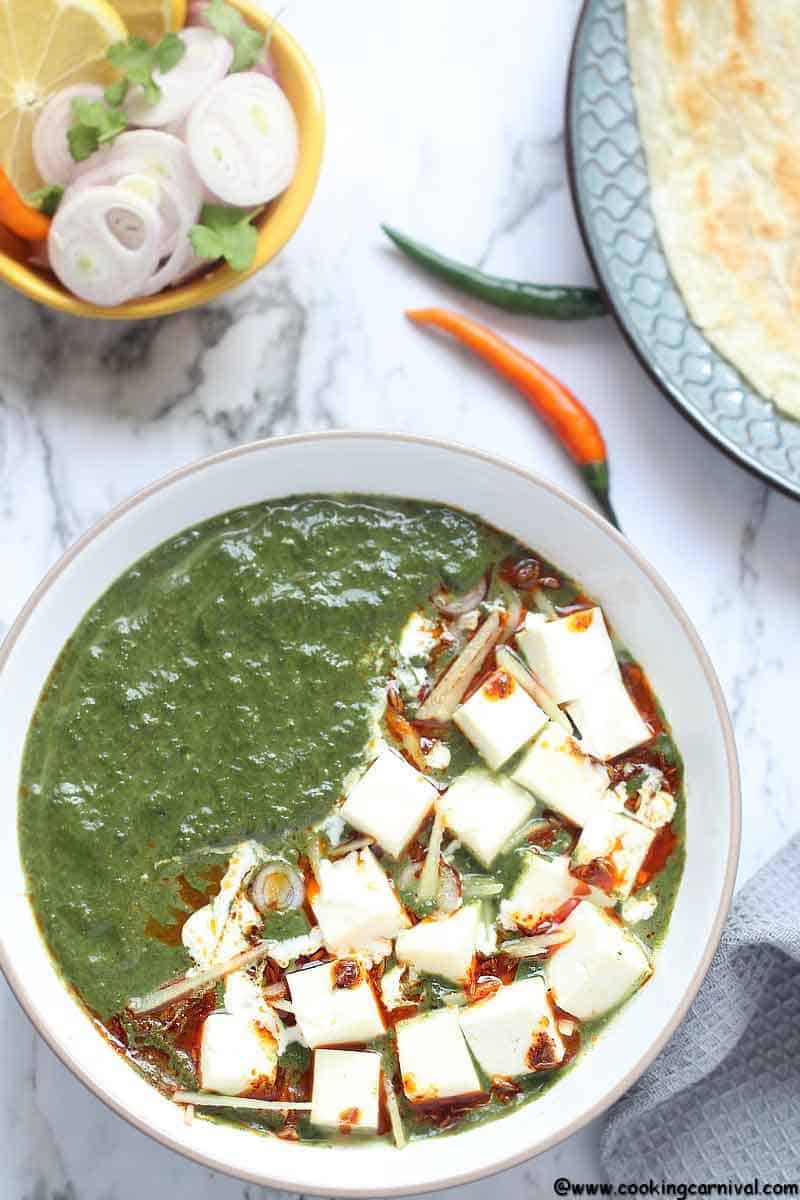 Instant Pot Palak Paneer - Indian Cottage Cheese in Smooth, luscious, Delicious, Creamy Spinach Gravy. Palak Paneer is one of the most loved North Indian Dishes across the world. It is Eaten with Roti, Paratha, Naan, Parotta or Rice. This Vegetarian Indian Instant Pot Recipe is a healthy weeknight dinner recipe that's naturally gluten free, paleo and can easily be made Vegan by using tofu instead of Paneer and Oil instant of Ghee/clarified butter.