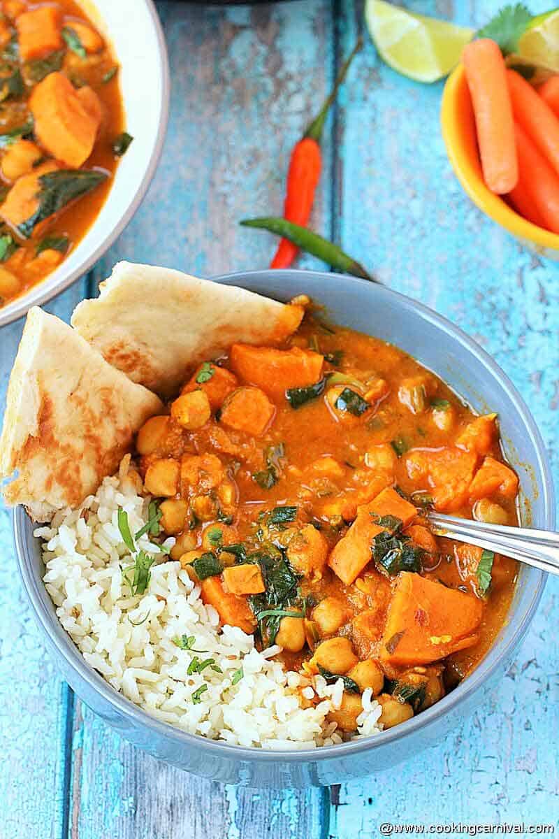 Sweet potato curry made in instant pot and served in bowl with rice and Naan