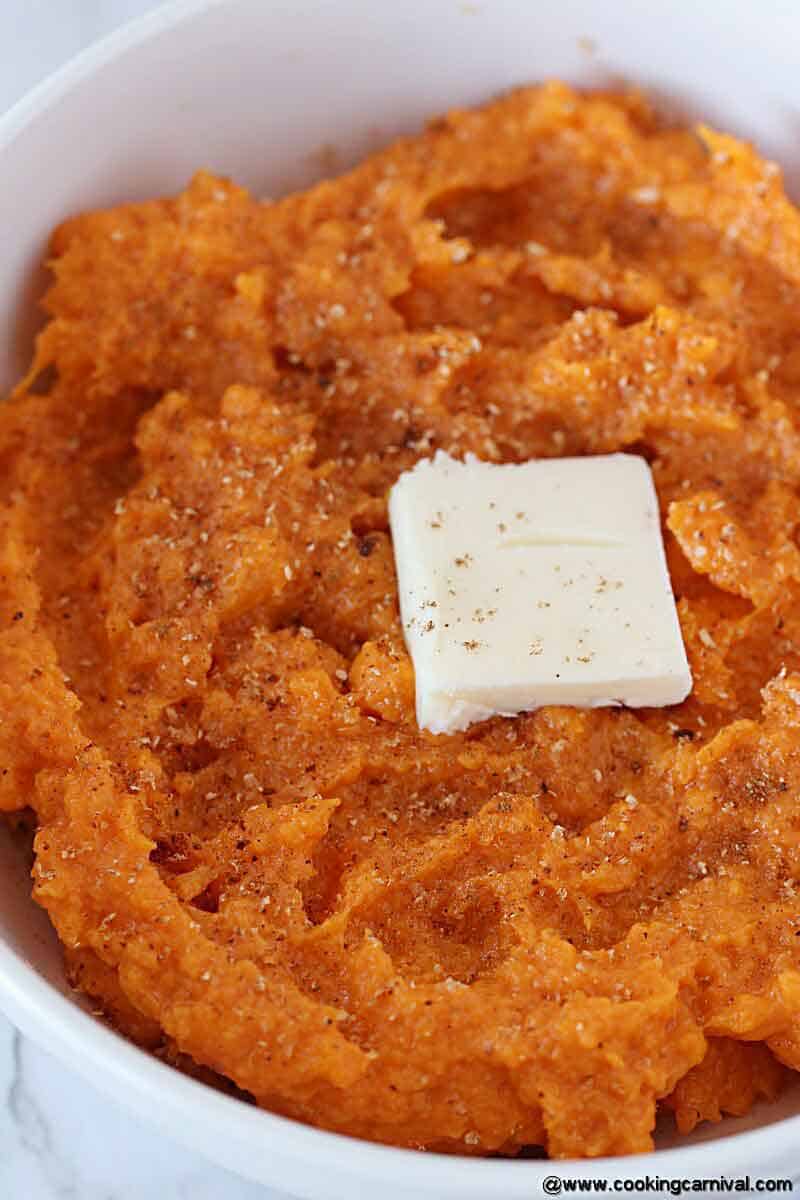 Mashed sweet potatoes, topped with cinnamon powder, nutmeg powder and butter