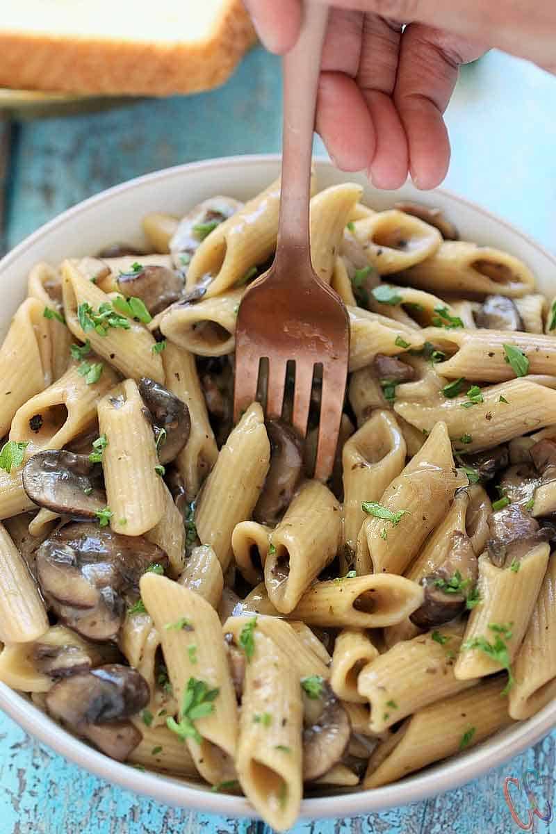 This Instant Pot Vegan Mushroom Stroganoff Recipe is quick, easy, comforting, hearty, savory, creamy, delicious, nut-free and perfect for weeknight Dinner.