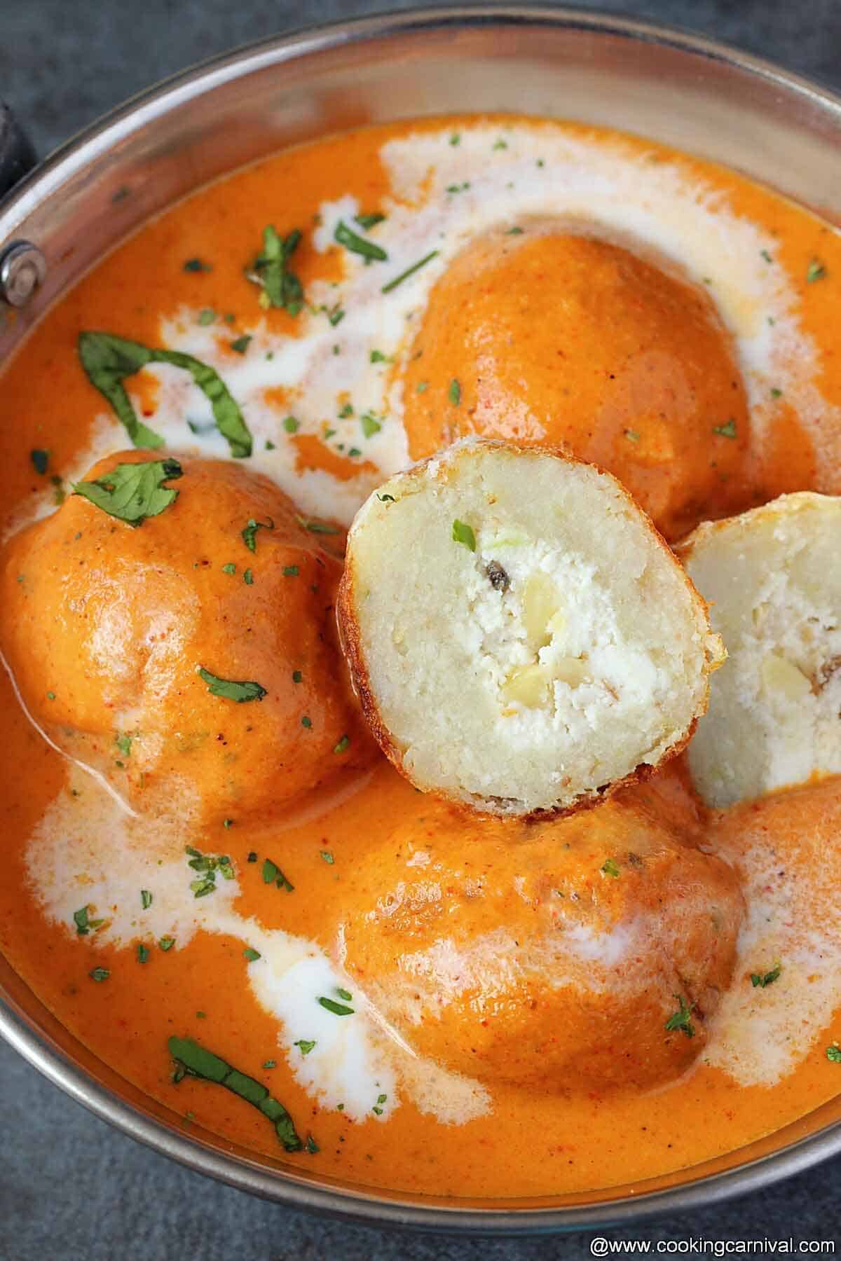 Close up shot of malai kofta in steel bowl