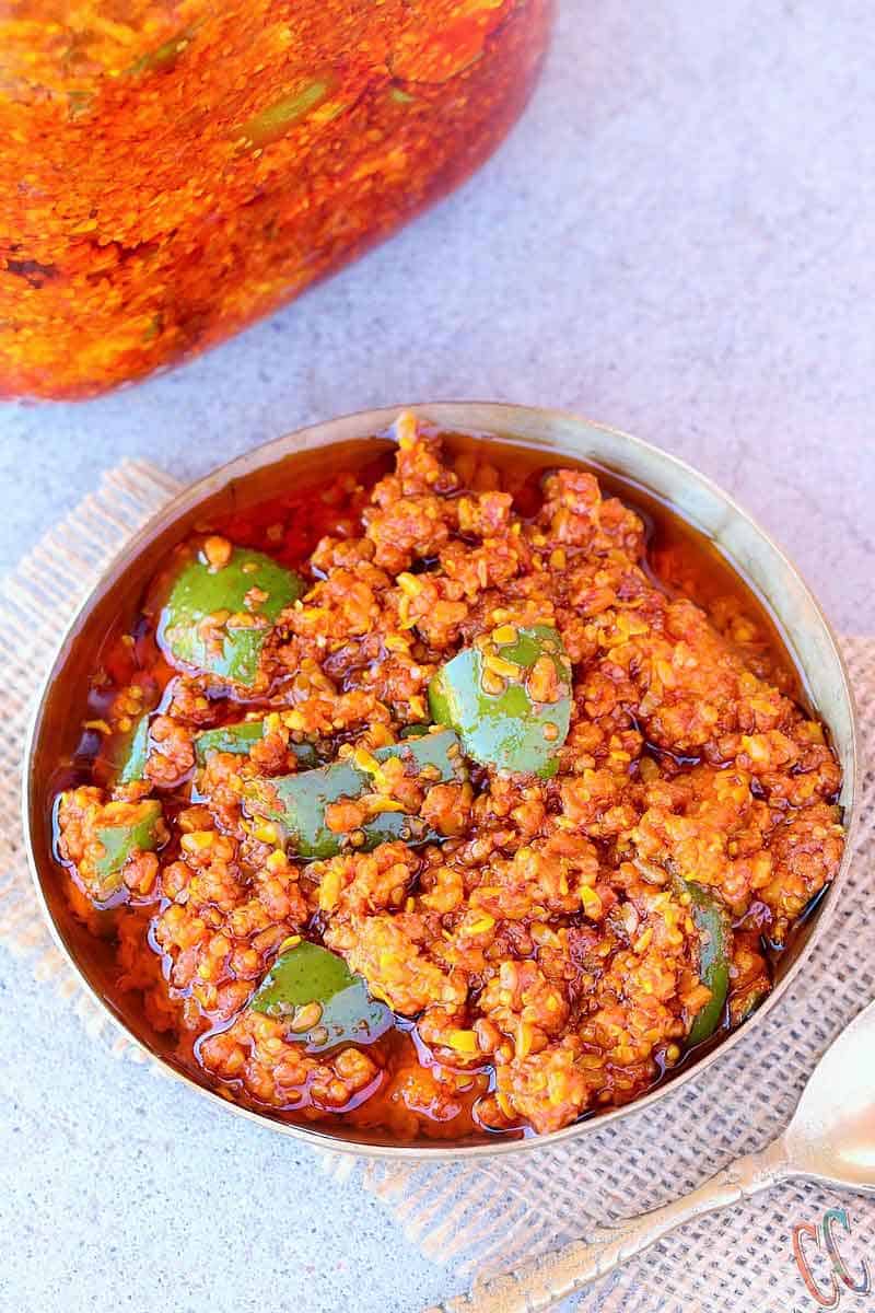 Mango Pickle | Gujarati traditional Methiya Keri Nu Athanu - Finger licking Pickle recipe Made with fresh raw mango, Methi Na Kuriya (coarsly crushed Fanugreek Seeds), Rai Na kuriya (Coarsely crushed mustard seeds), Salt, Red chili powder, Asafetida and Oil.