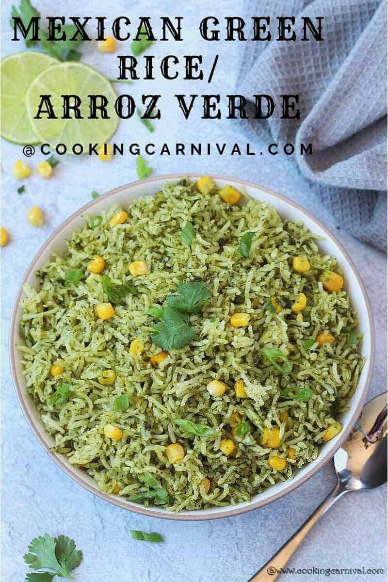 Arroz Verde in a White bowl, lemon slices, corn, cilantro and gray tea towel on the side