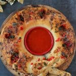 Mexican Stromboli Christmas Wreath Appetizer on a baking stone