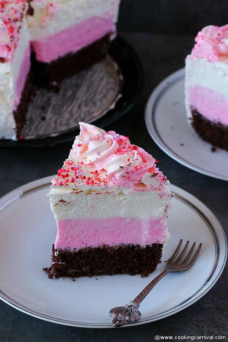 Close up shot of ice cream cake on white plate