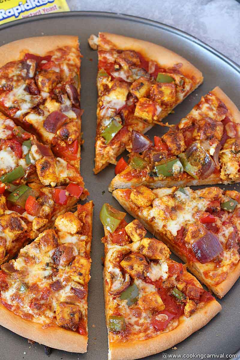 Homemade paneer Pizza Slices on a baking sheet.