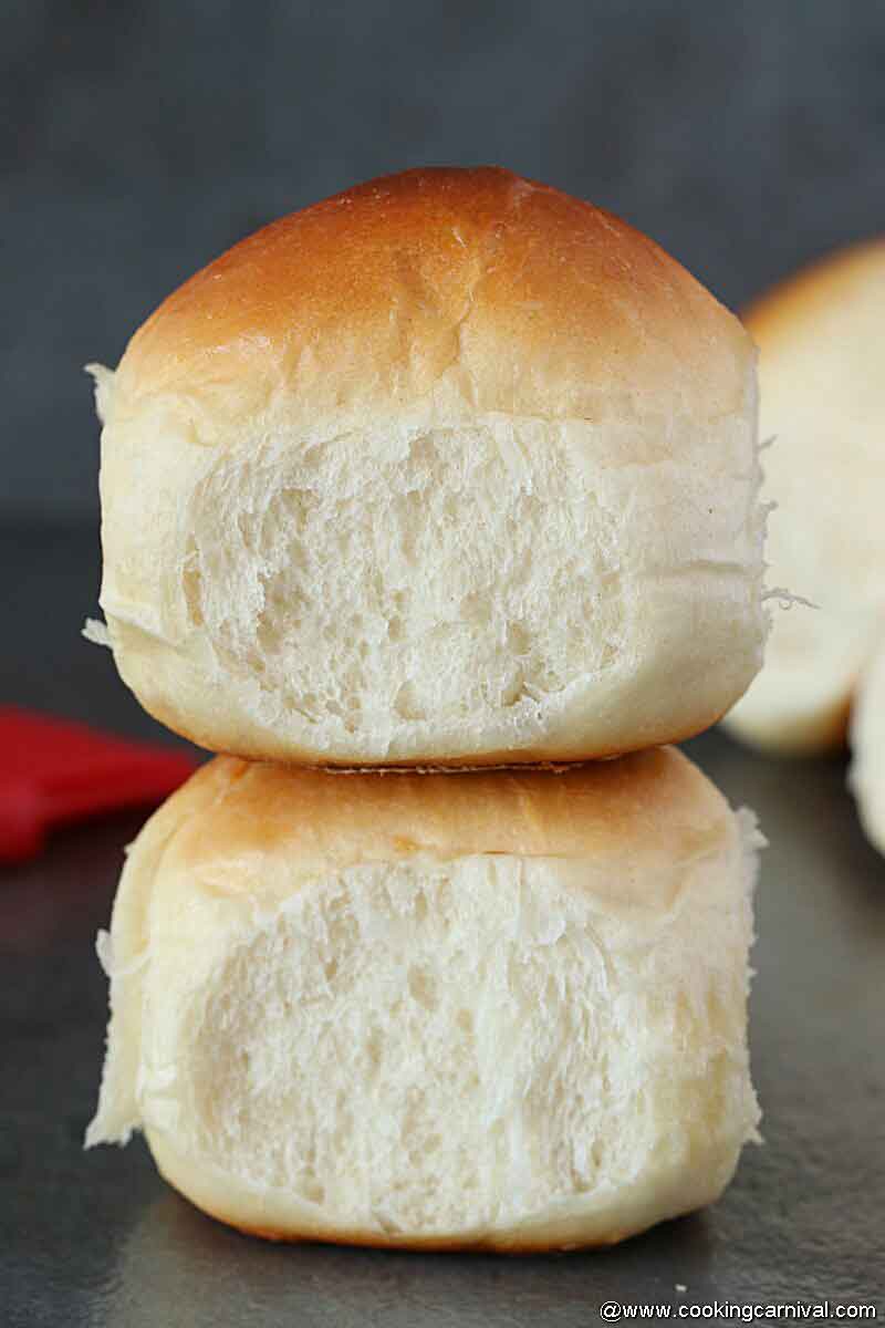 2 Dinner rolls on a black tile