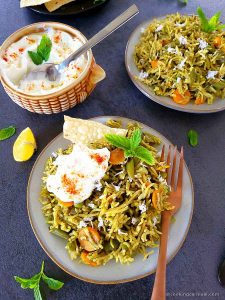 Pudina rice, curd and papad served in plate, curd bowl on the side