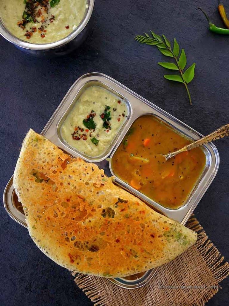 rava dosa, coconut chutney and sambar on a plate