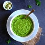 green mango chutney in a white bowl