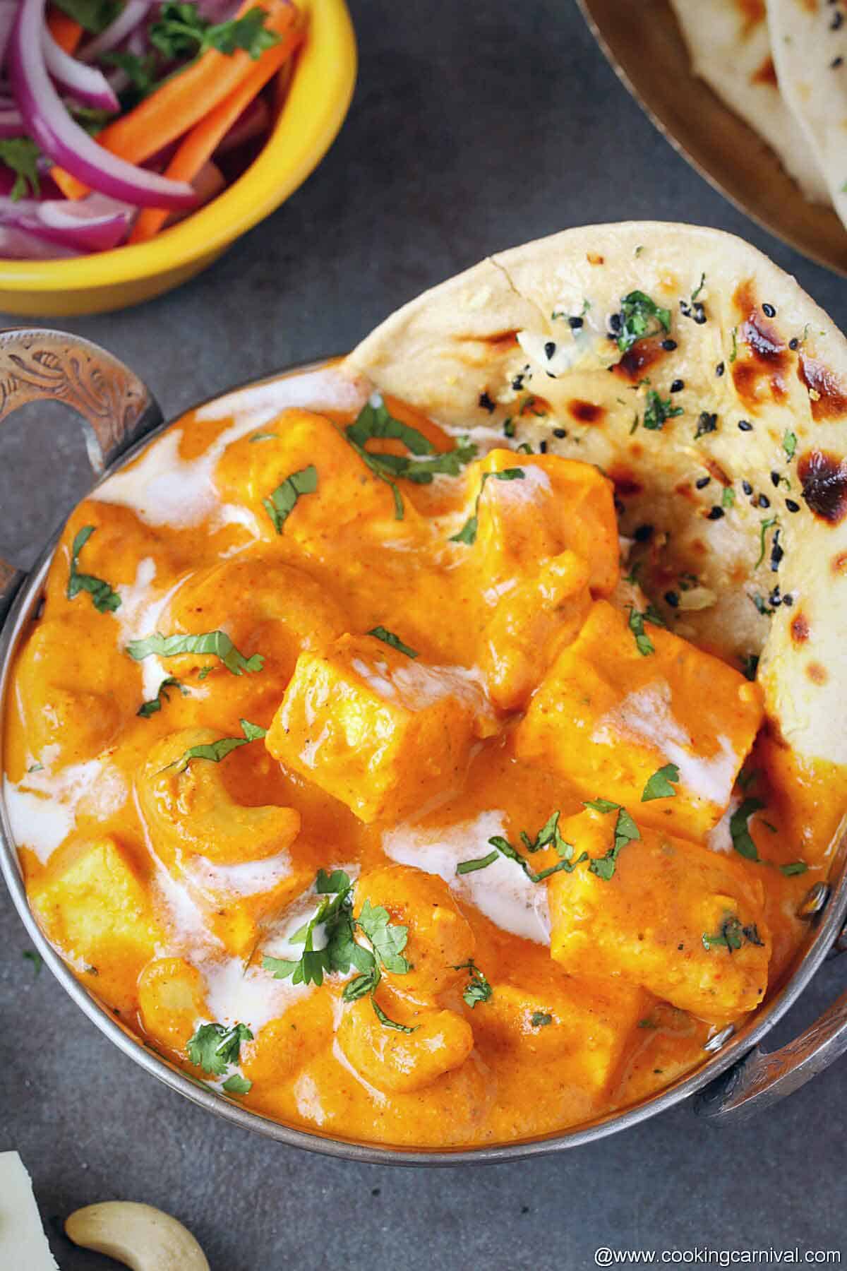 Tandoori roti and kaju paneer served in steel bowl