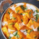 Reshmi kaju paneer garnishd with cilantro and cream