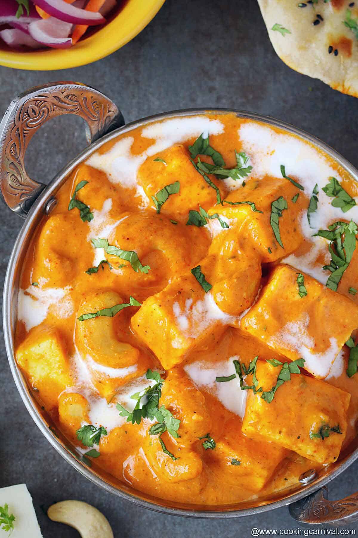 Reshmi kaju paneer garnishd with cilantro and cream