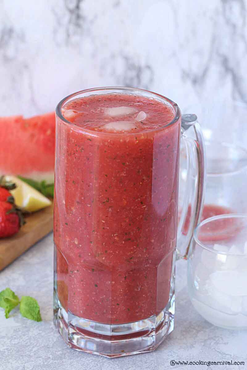 Watermelon strawberry lemonade in a jug.