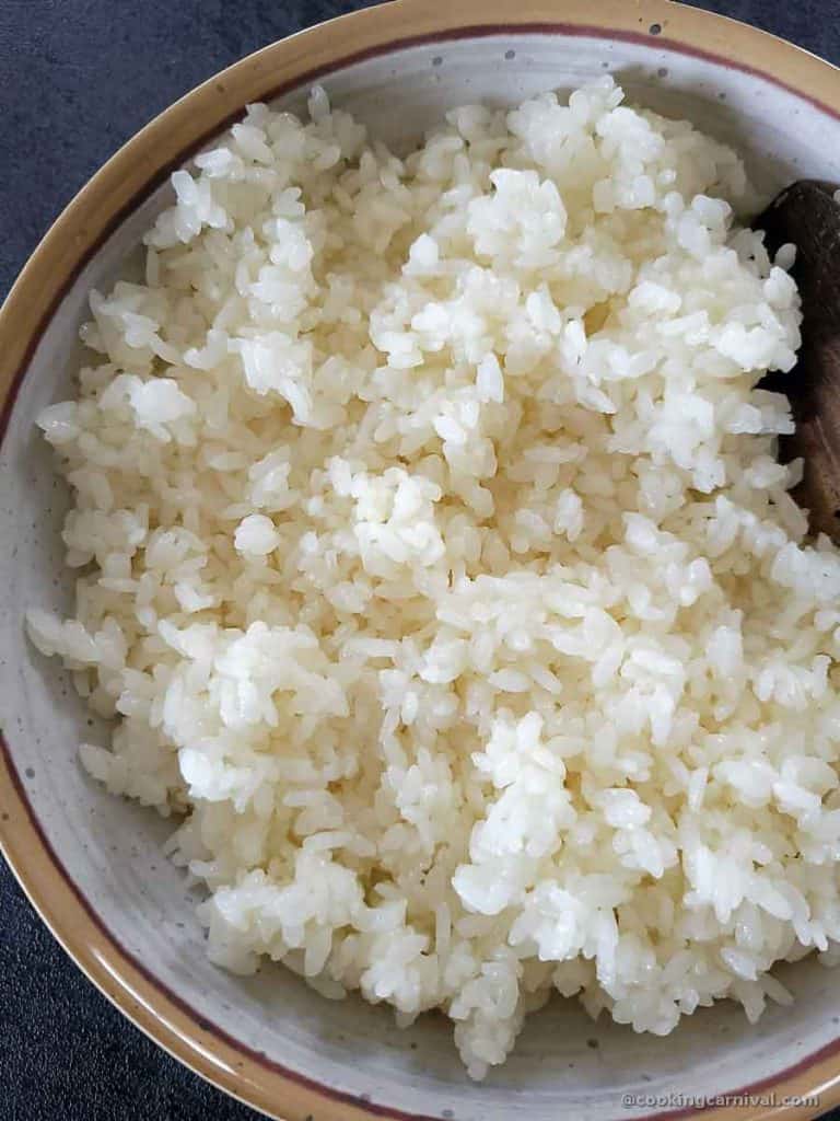 a bowl of cooked sushi rice