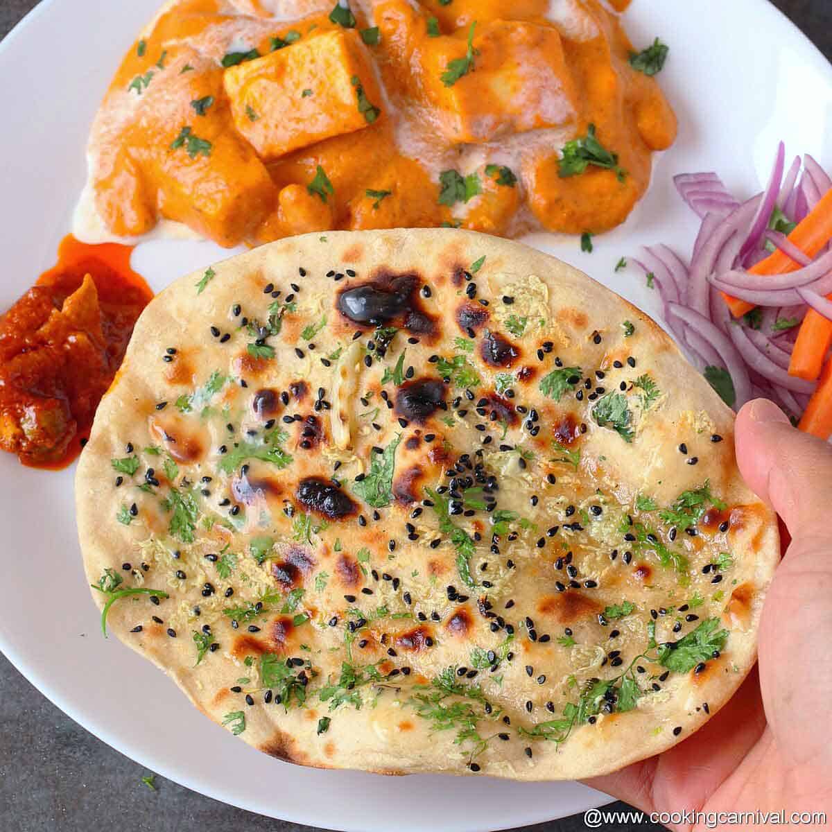 serving garlic roti with curry