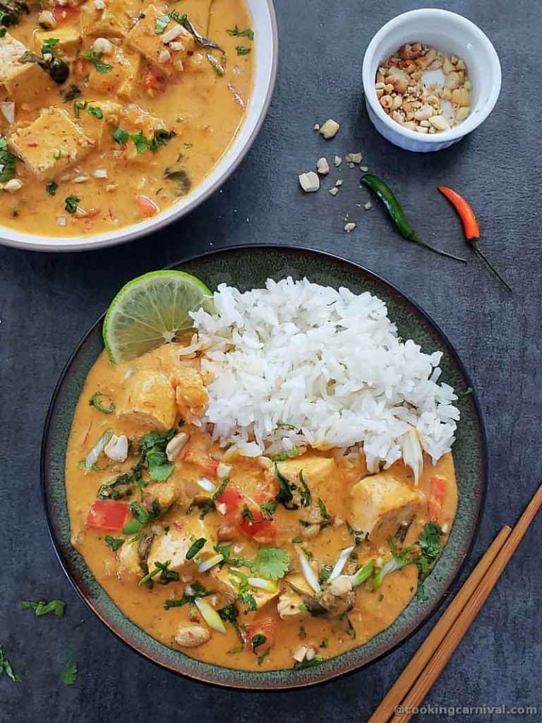 Tofu thai curry in a bowl served with jasmine rice