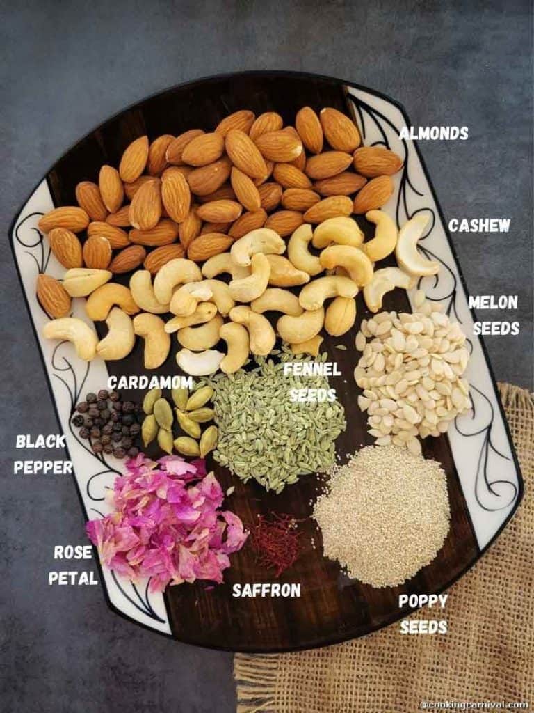 Thandai masala powder ingredients in a plate