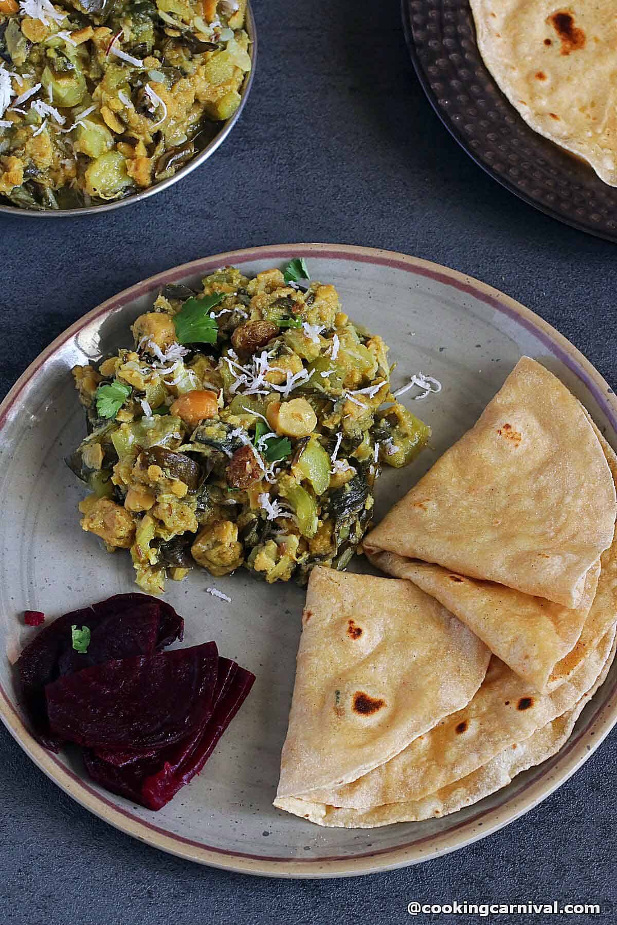 Turiya patra nu shaak, roti and beetroot in a plate.