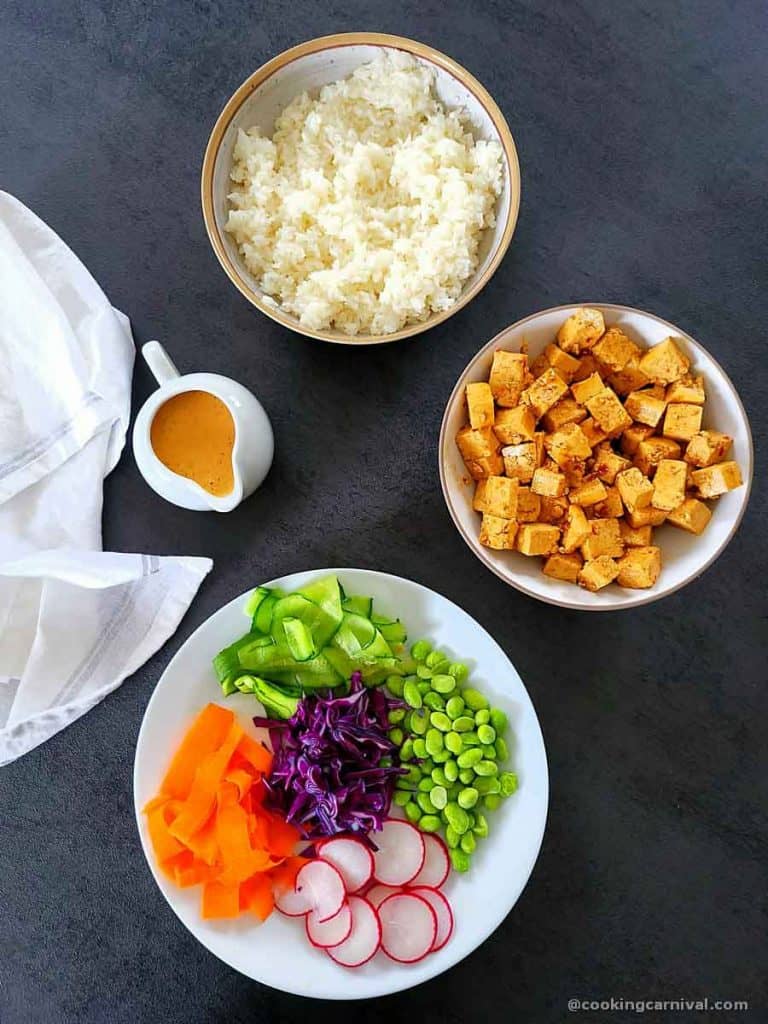 poke bowl ingredients on gray table