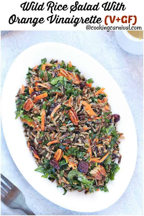 Wild Rice Salad - Scrumptious, Bursting with citrus flavors, Loaded with Vitamin C rich Kale and Vitamin A rich Carrots, lots of Pecans and cranberries for extra crunch and taste, Vegan Salad recipe that can be enjoyed at any time of the year.