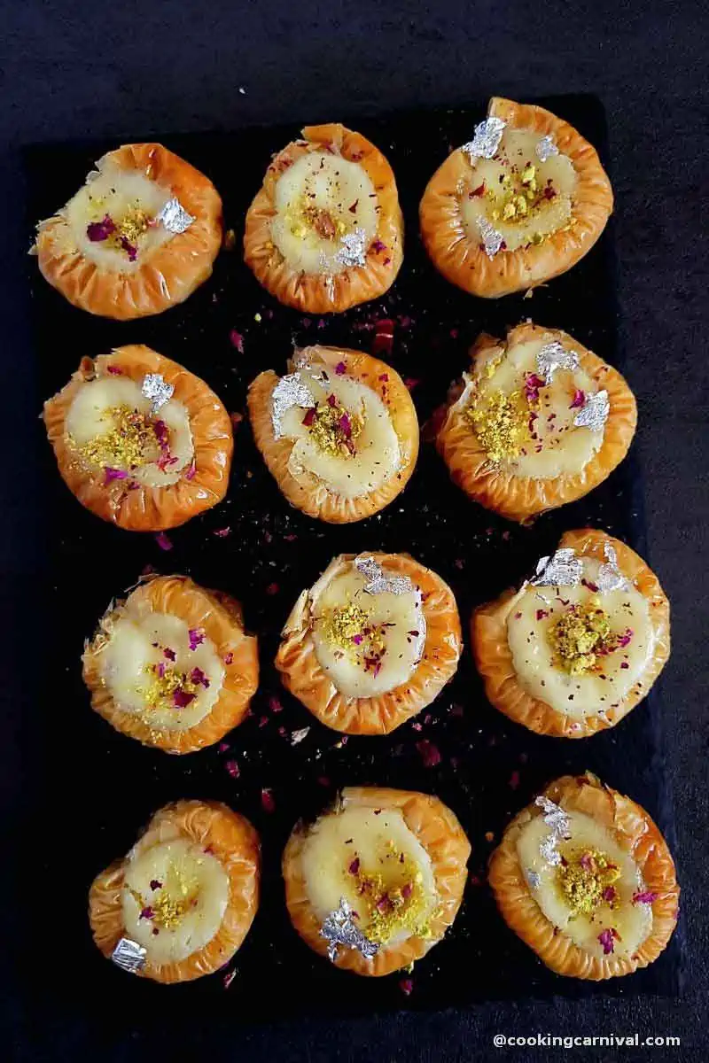 Cheesecake Baklava bracelet on a cheese board.