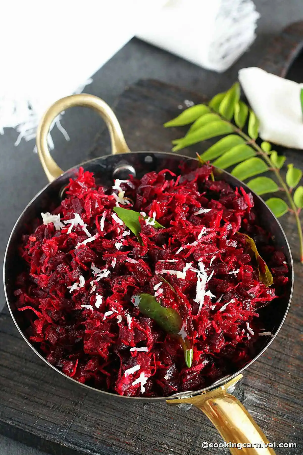 beetroot thoran (stir-fry) in a bowl, garnished with fresh coconut. 